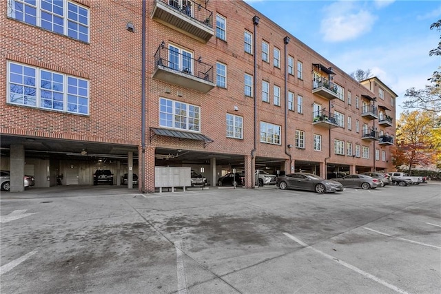 view of building exterior with covered parking