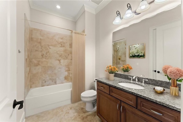 full bathroom featuring vanity, ornamental molding, tiled shower / bath, tile patterned floors, and toilet