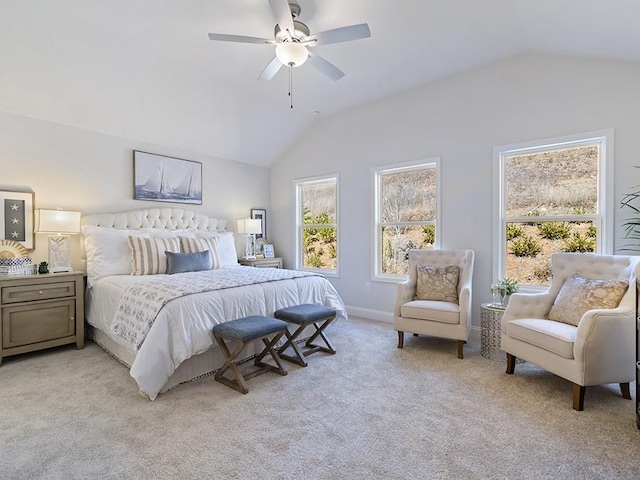 bedroom with light carpet, ceiling fan, lofted ceiling, and baseboards