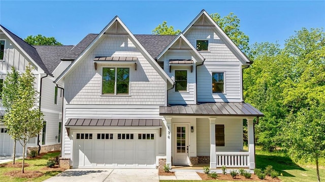 136 Beutell St, Norcross, GA 30071 - craftsman house featuring covered porch, a standing seam roof, concrete driveway, and metal roof