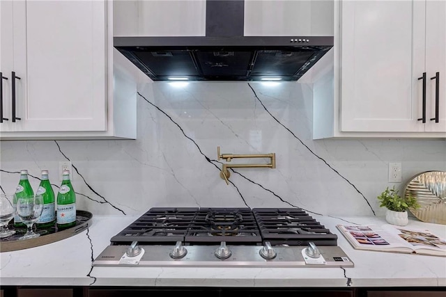136 Beutell St, Norcross, GA 30071 - kitchen featuring ventilation hood, stainless steel gas cooktop, decorative backsplash, and white cabinets
