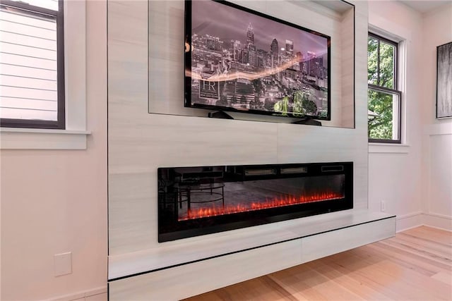 136 Beutell St, Norcross, GA 30071 - detailed view of a fireplace, wood finished floors, and baseboards