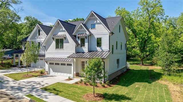 136 Beutell St, Norcross, GA 30071 - view of front of property with a standing seam roof, driveway, an attached garage, and a front lawn
