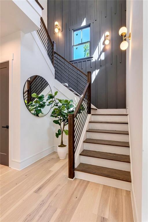 136 Beutell St, Norcross, GA 30071 - staircase featuring wood finished floors and baseboards