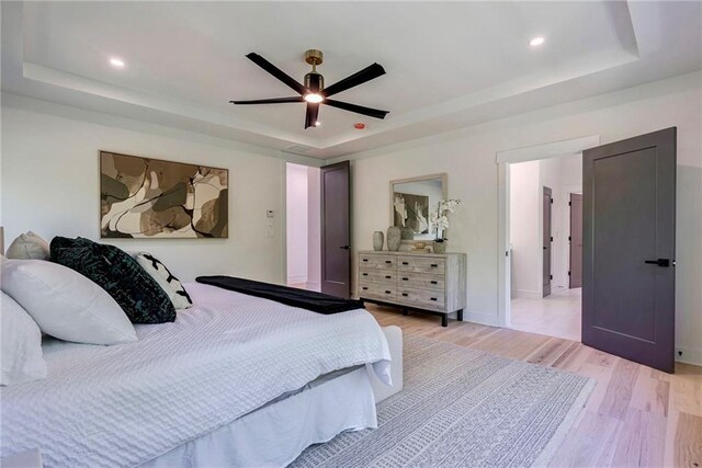 136 Beutell St, Norcross, GA 30071 - bedroom featuring a raised ceiling, light wood-style flooring, recessed lighting, a ceiling fan, and baseboards