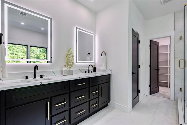 136 Beutell St, Norcross, GA 30071 - bathroom featuring a stall shower, double vanity, and baseboards