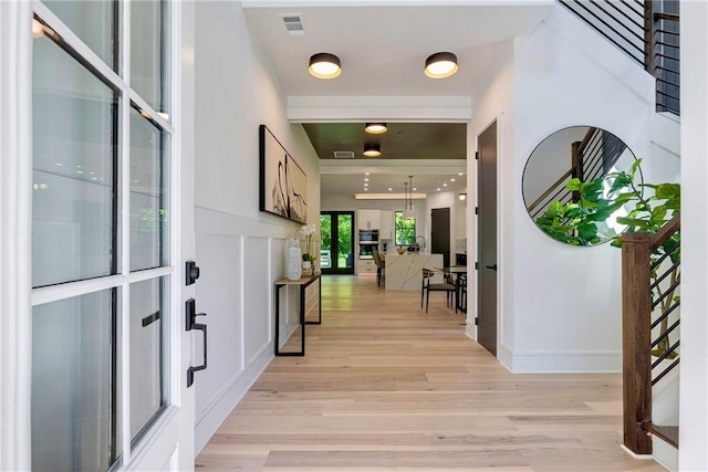 136 Beutell St, Norcross, GA 30071 - foyer entrance featuring light wood-style floors, stairs, and baseboards