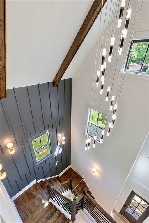 136 Beutell St, Norcross, GA 30071 - stairway with wood finished floors, beam ceiling, and baseboards