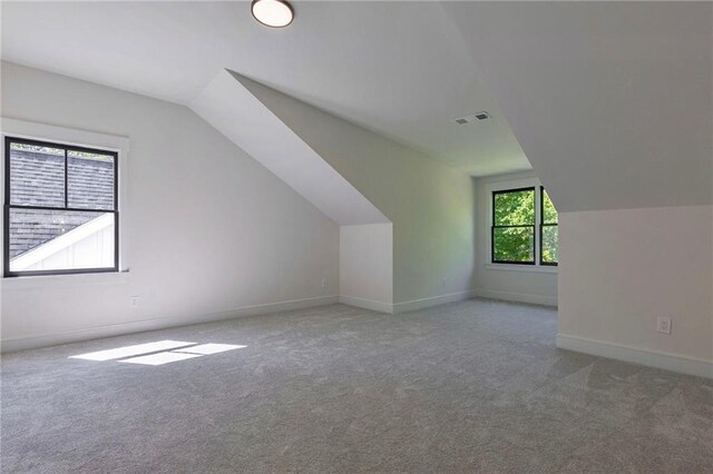 136 Beutell St, Norcross, GA 30071 - bonus room featuring lofted ceiling, carpet flooring, and baseboards