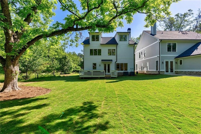 136 Beutell St, Norcross, GA 30071 - rear view of house with french doors, a yard, and a wooden deck