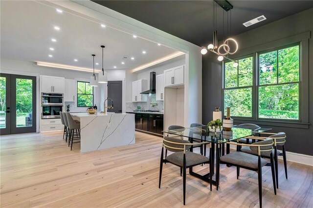 136 Beutell St, Norcross, GA 30071 - dining room with light wood finished floors and recessed lighting