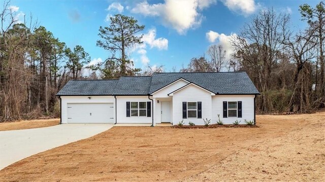 ranch-style home featuring a garage