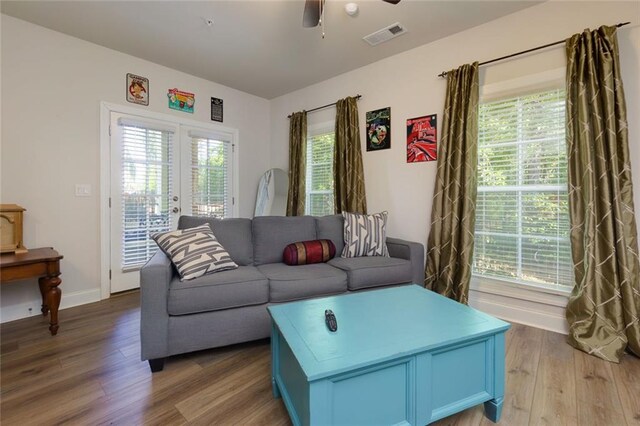 451 Burton Dr Unit 32, Alpharetta, GA 30009 - living area featuring light wood finished floors, a ceiling fan, french doors, and baseboards