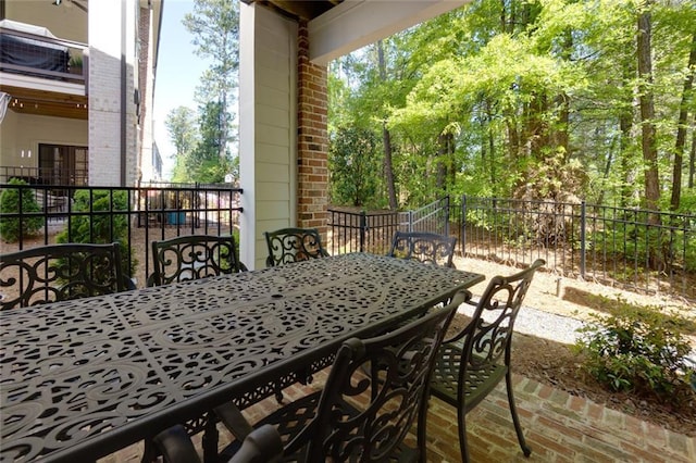 451 Burton Dr Unit 32, Alpharetta, GA 30009 - view of patio / terrace with outdoor dining space and fence