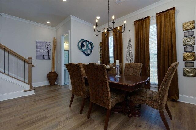 451 Burton Dr Unit 32, Alpharetta, GA 30009 - dining room featuring a chandelier, ornamental molding, wood finished floors, baseboards, and stairway