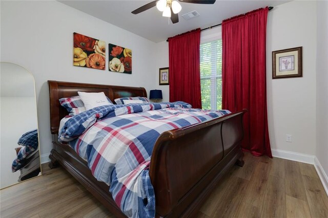 451 Burton Dr Unit 32, Alpharetta, GA 30009 - bedroom with wood finished floors, baseboards, and a ceiling fan