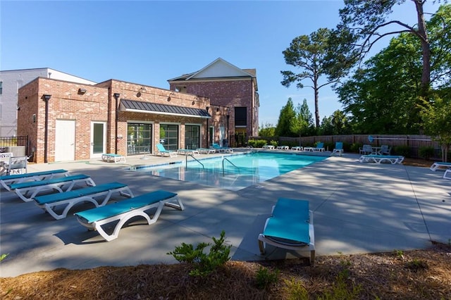 451 Burton Dr Unit 32, Alpharetta, GA 30009 - community pool with a patio and fence