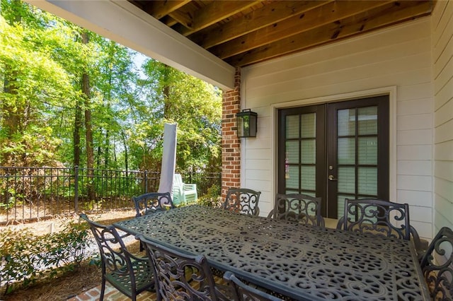 451 Burton Dr Unit 32, Alpharetta, GA 30009 - view of patio featuring french doors, fence, and outdoor dining area