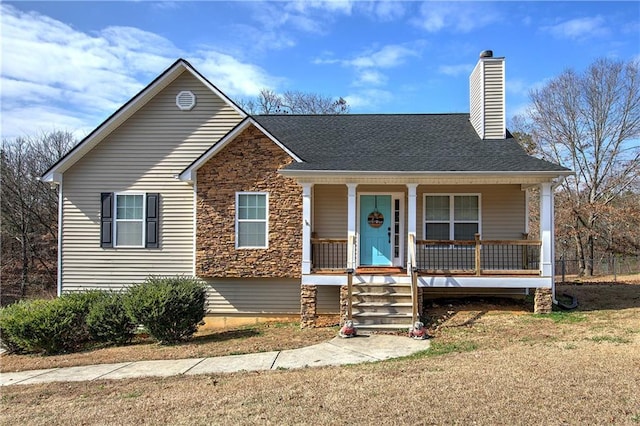 view of front of house featuring a front lawn and covered porch