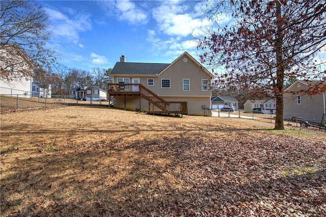 back of house featuring a deck