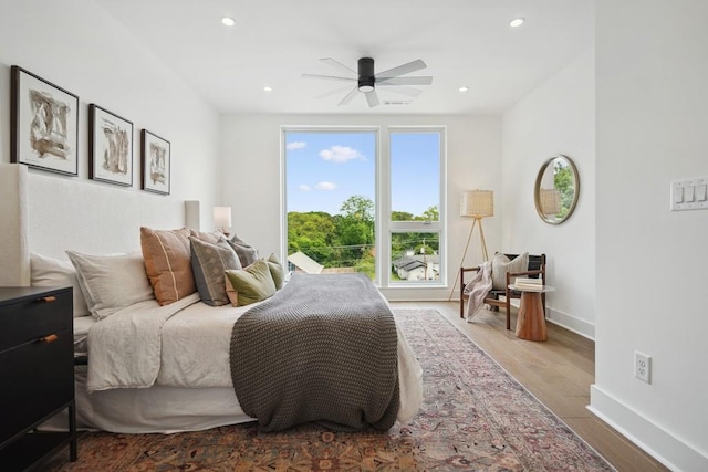 bedroom with recessed lighting, wood finished floors, baseboards, and ceiling fan