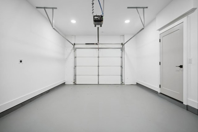 garage featuring baseboards, recessed lighting, and a garage door opener