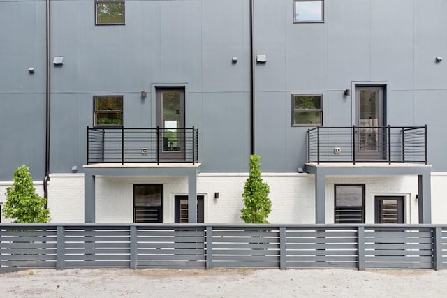 view of property with fence