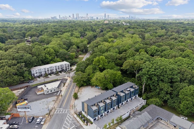 bird's eye view featuring a city view and a view of trees