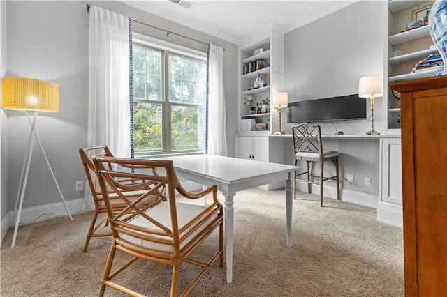 office featuring baseboards, visible vents, built in features, ornamental molding, and carpet floors