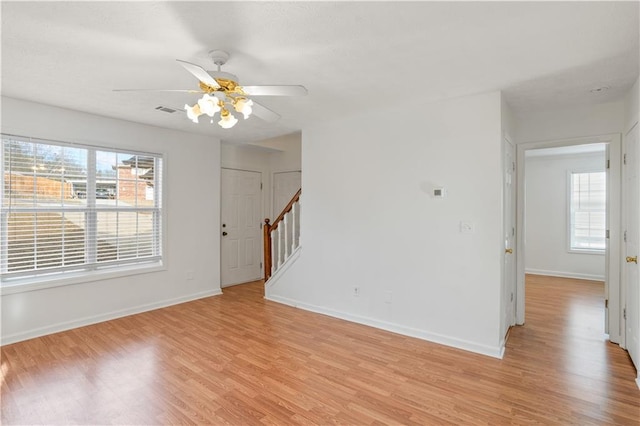 empty room featuring ceiling fan and light hardwood / wood-style floors