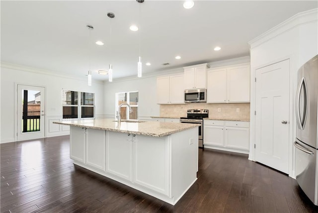 4171 Towncastle Ln, Buford, GA 30518 - kitchen featuring appliances with stainless steel finishes, a sink, backsplash, white cabinetry, and light stone counters