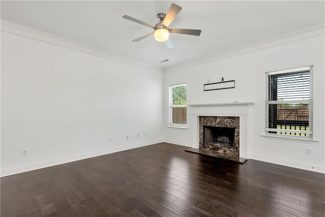 4171 Towncastle Ln, Buford, GA 30518 - unfurnished living room with crown molding, a ceiling fan, a high end fireplace, baseboards, and wood finished floors