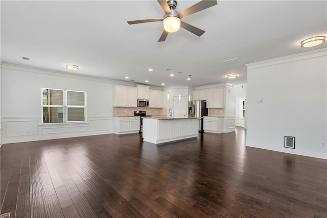 4171 Towncastle Ln, Buford, GA 30518 - unfurnished living room with crown molding, dark wood-style floors, a sink, a ceiling fan, and recessed lighting
