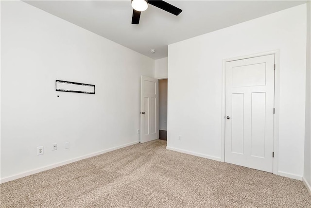 4171 Towncastle Ln, Buford, GA 30518 - unfurnished bedroom with light carpet, baseboards, and a ceiling fan