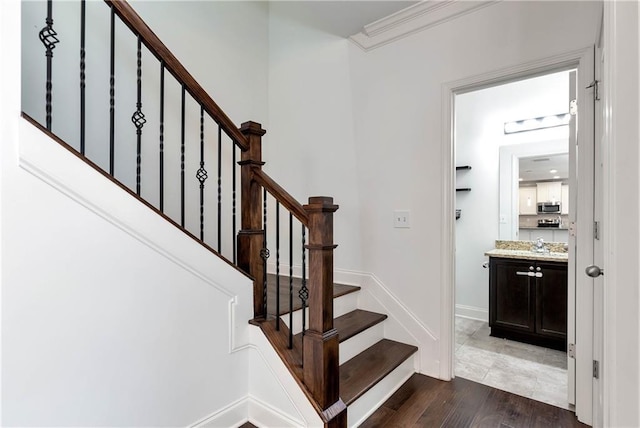 4171 Towncastle Ln, Buford, GA 30518 - stairway featuring wood finished floors and ornamental molding