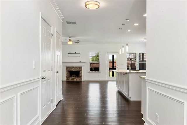 4171 Towncastle Ln, Buford, GA 30518 - unfurnished living room featuring a ceiling fan, ornamental molding, a fireplace, dark wood-style floors, and recessed lighting