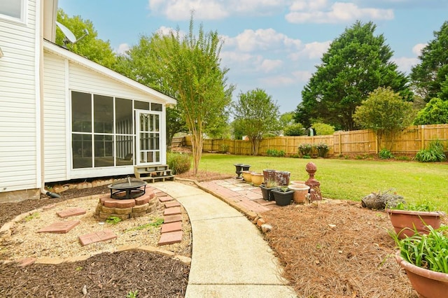 view of yard featuring a patio area and an outdoor fire pit