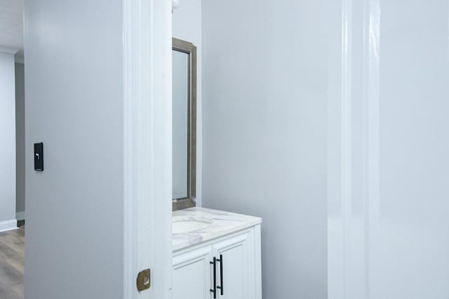 bathroom featuring vanity and hardwood / wood-style floors