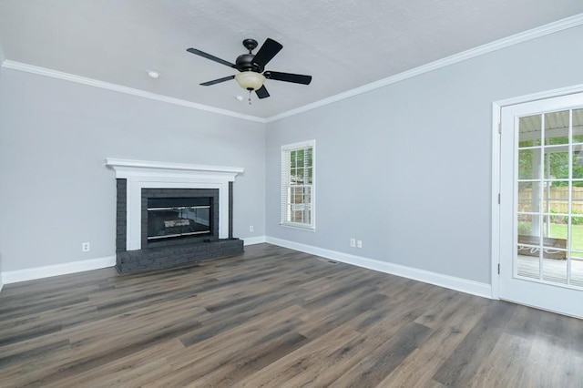 unfurnished living room featuring ornamental molding, a wealth of natural light, and dark hardwood / wood-style flooring