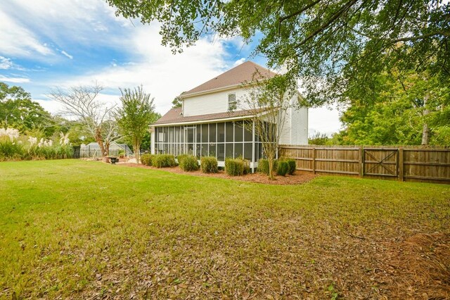 view of yard with a sunroom