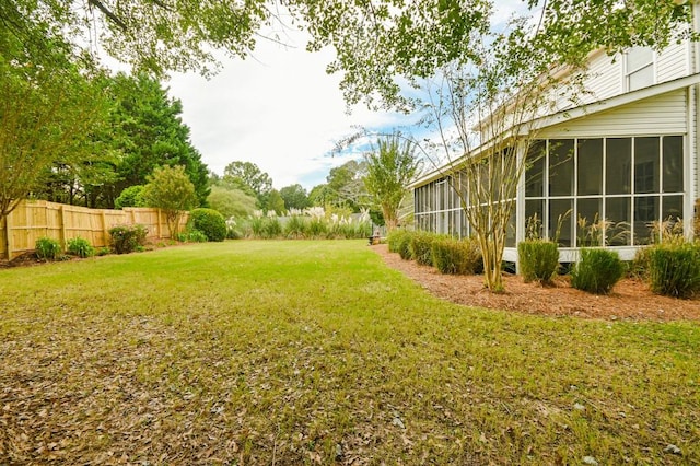 view of yard featuring a sunroom