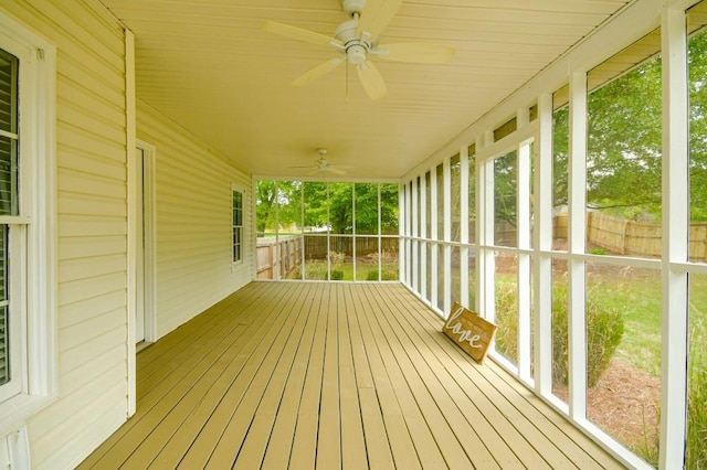 wooden terrace featuring ceiling fan