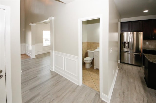 interior space with toilet and wood-type flooring