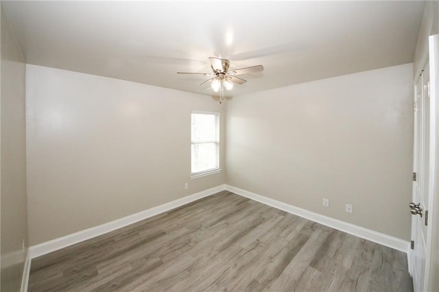 spare room with ceiling fan and light hardwood / wood-style flooring