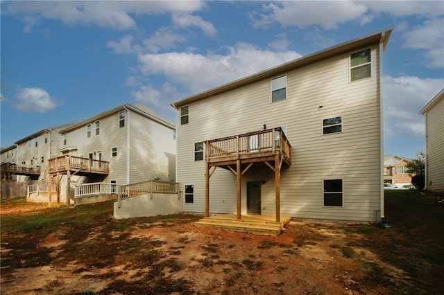 rear view of property with a balcony