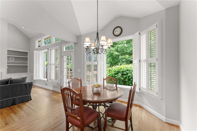 2026 Cresthaven Walk, Woodstock, GA 30189 - kitchen with dishwasher, a sink, light wood-type flooring, plenty of natural light, and vaulted ceiling