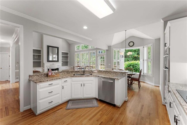 2026 Cresthaven Walk, Woodstock, GA 30189 - bedroom featuring a tray ceiling, light wood finished floors, baseboards, ceiling fan, and crown molding