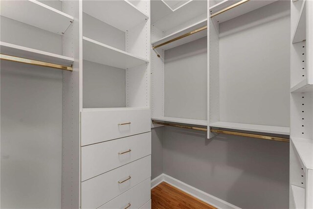 2026 Cresthaven Walk, Woodstock, GA 30189 - spare room featuring a tray ceiling, a chandelier, wood finished floors, crown molding, and baseboards