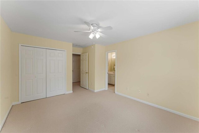 2026 Cresthaven Walk, Woodstock, GA 30189 - unfurnished bedroom with baseboards, light carpet, a closet, a ceiling fan, and ensuite bathroom