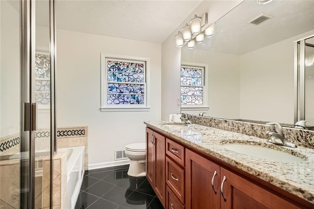 full bathroom featuring vanity, tile patterned flooring, toilet, and independent shower and bath